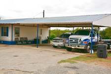 Carport of manufactured home located on IH 35 West Side Frontage Road, Dilley, TX