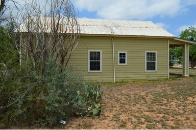 View of left side of house located at 601 Carrizo St., Cotulla, TX