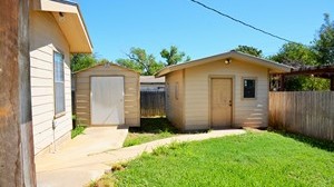 2 storage buildings of wood frame residential house located at 903 Live Oak, Cotulla, TX